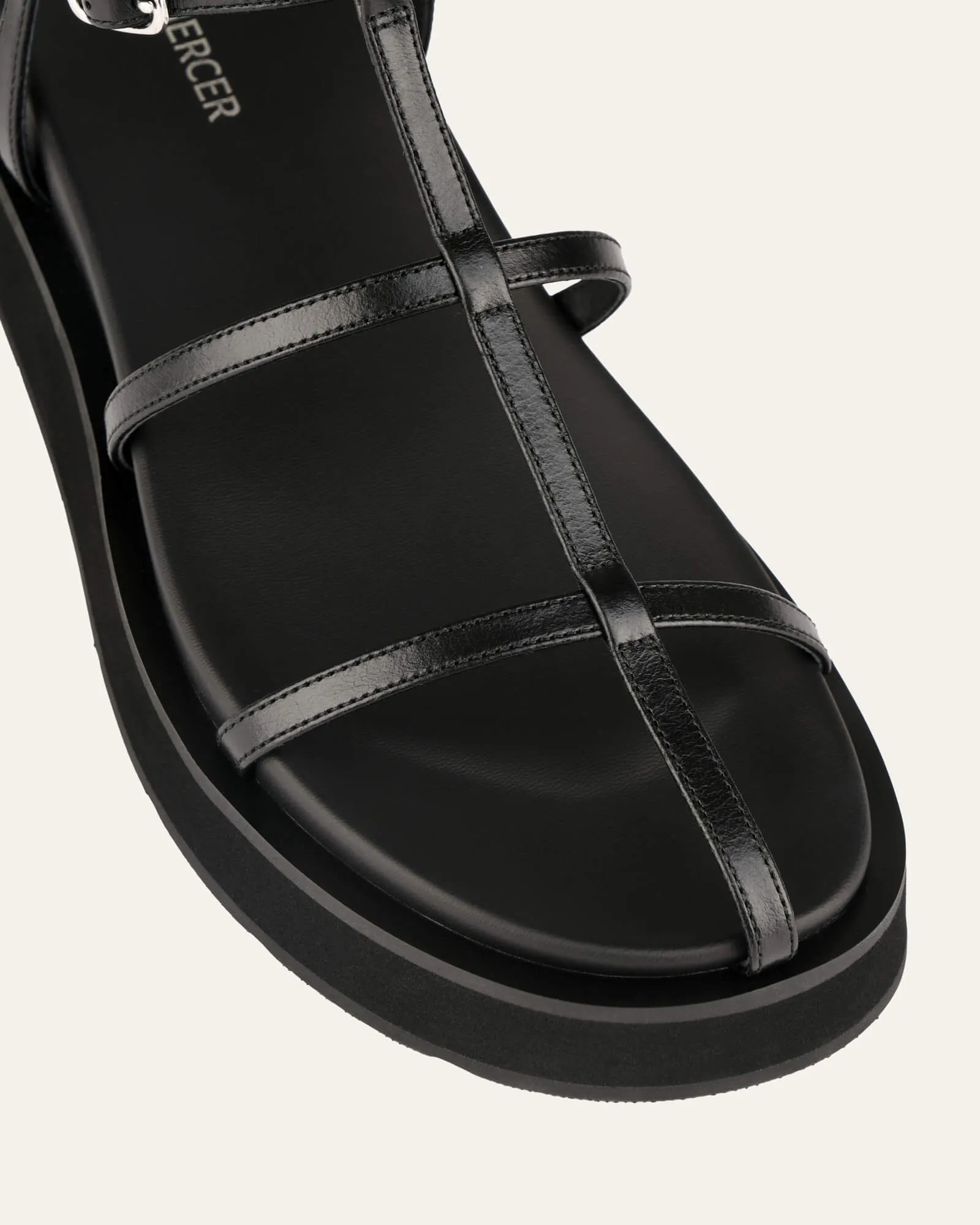 SANDALES PLATES MINA EN CUIR NOIR